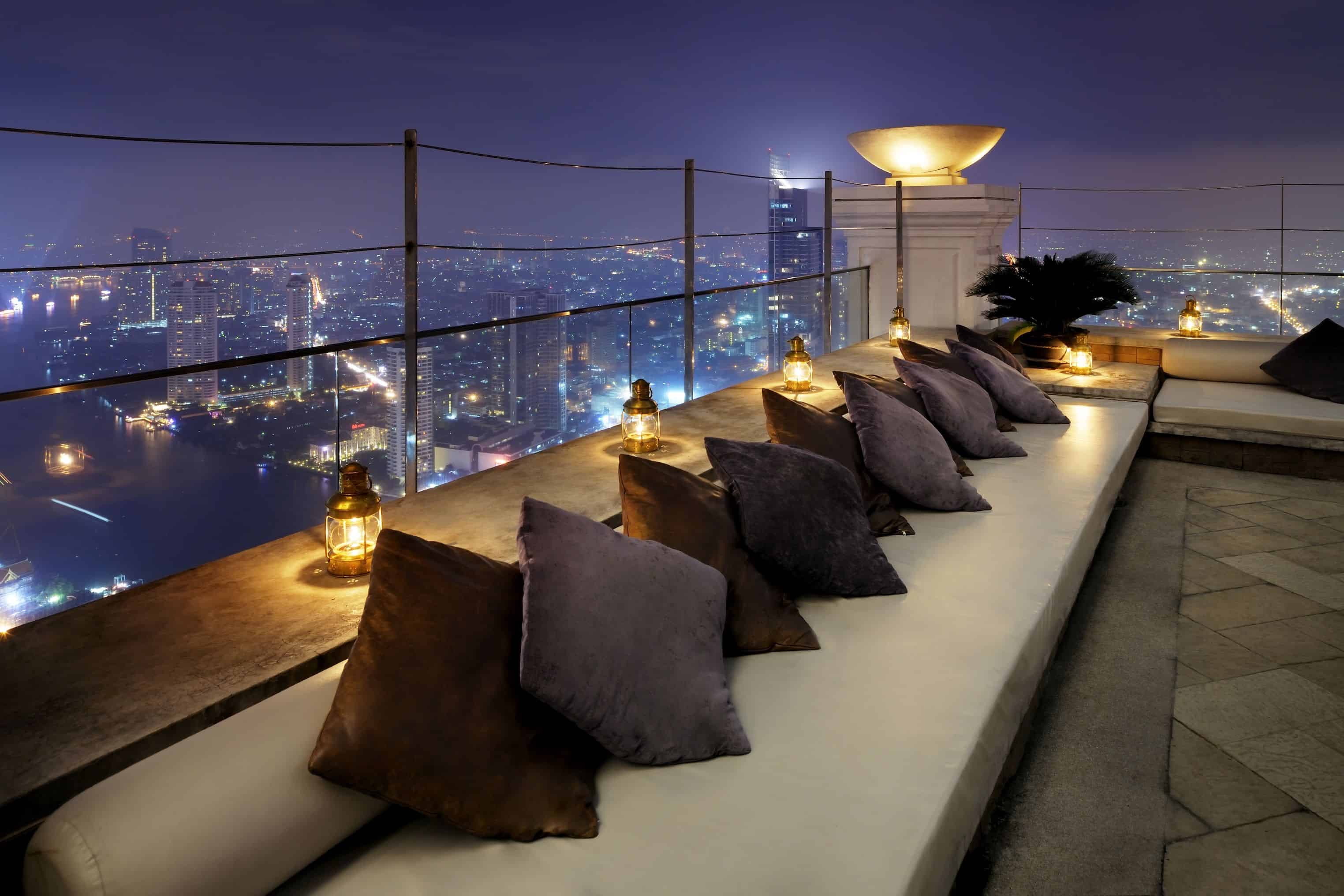 white couch with pillows on edge of terrace