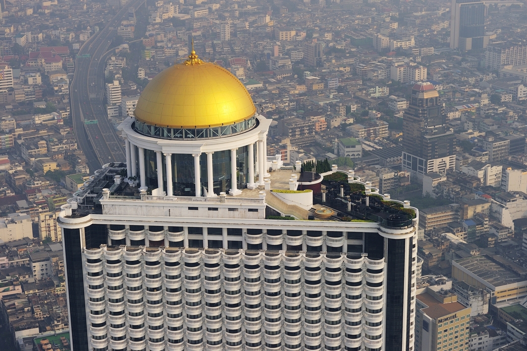 tall building with yellow dome and terrace