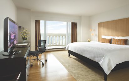 King size bed balcony and desk with chair