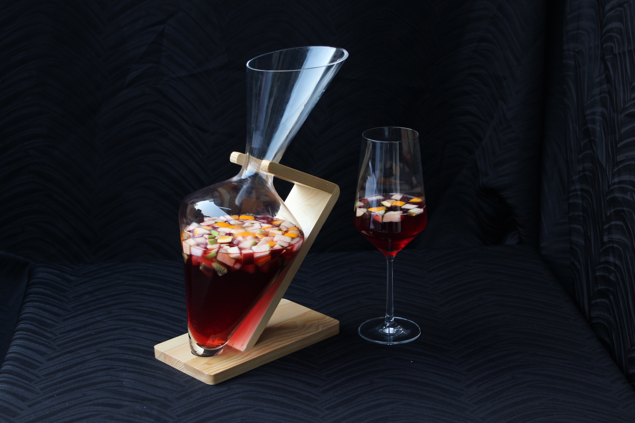 Irregular shaped red cocktail and glass