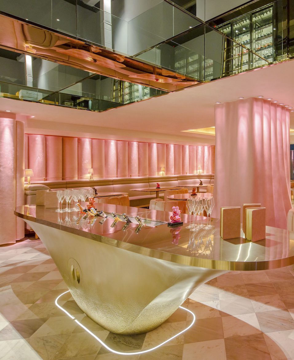 golden table at pink bar