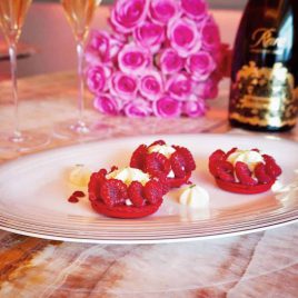 dessert bites on a plate with champaign in the background